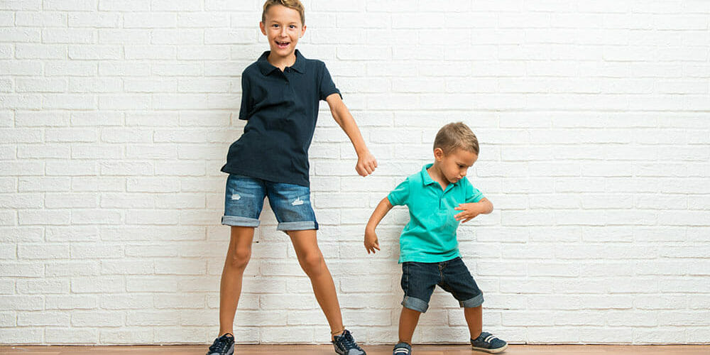 Two little brothers dancing