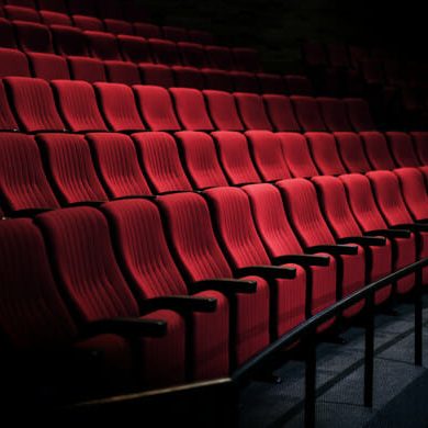 Rows of red seats in a theater